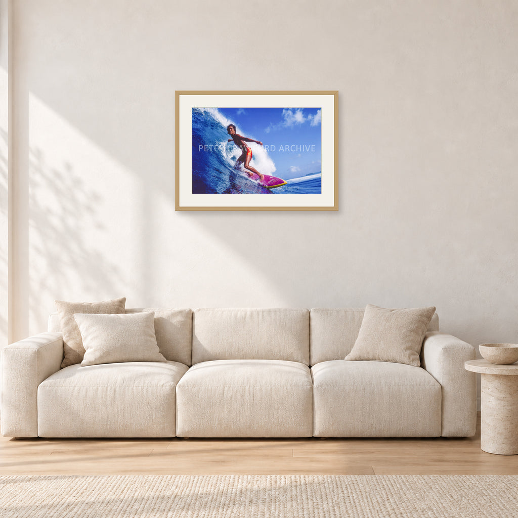 Louis Ferreira, 1978 by Peter Crawford — 60 × 40 cm, hayseed frame with white mat, shown in a light minimalist living room.