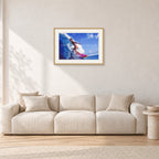 Louis Ferreira, 1978 by Peter Crawford — 60 × 40 cm, hayseed frame with white mat, shown in a light minimalist living room.