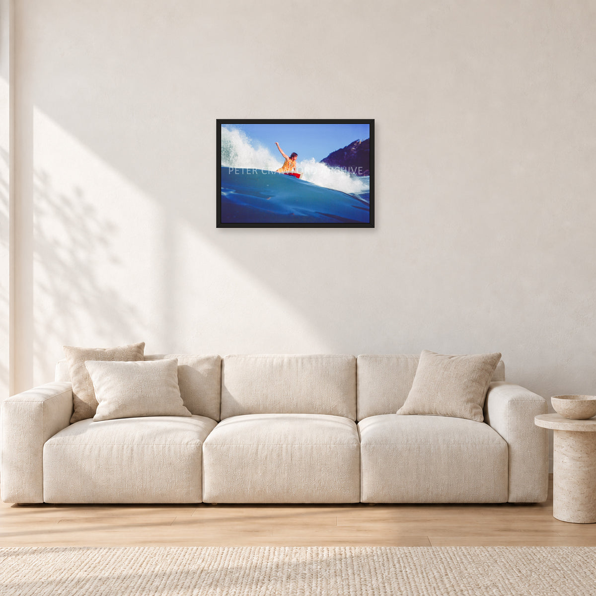 Mark Richards, Bells Beach 1979 by Peter Crawford — 60 × 40 cm, black frame, shown in a light minimalist living room.