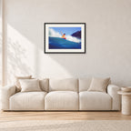 Mark Richards, Bells Beach 1979 by Peter Crawford — 60 × 40 cm, black frame with white mat, shown in a light minimalist living room.
