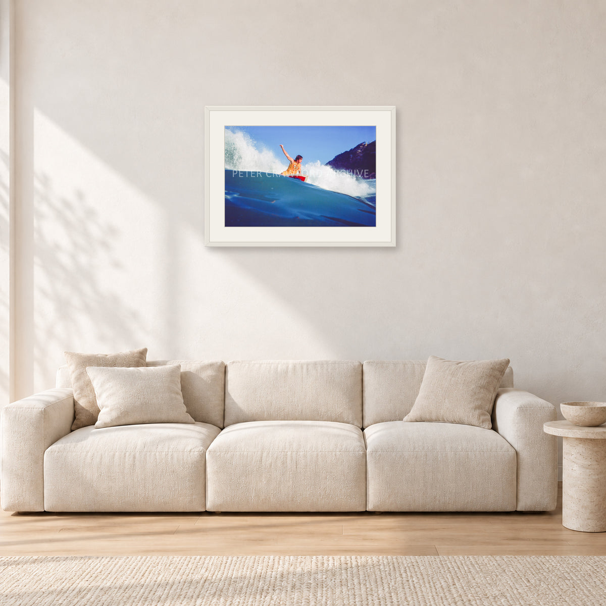 Mark Richards, Bells Beach 1979 by Peter Crawford — 60 × 40 cm, white frame with white mat, shown in a light minimalist living room.