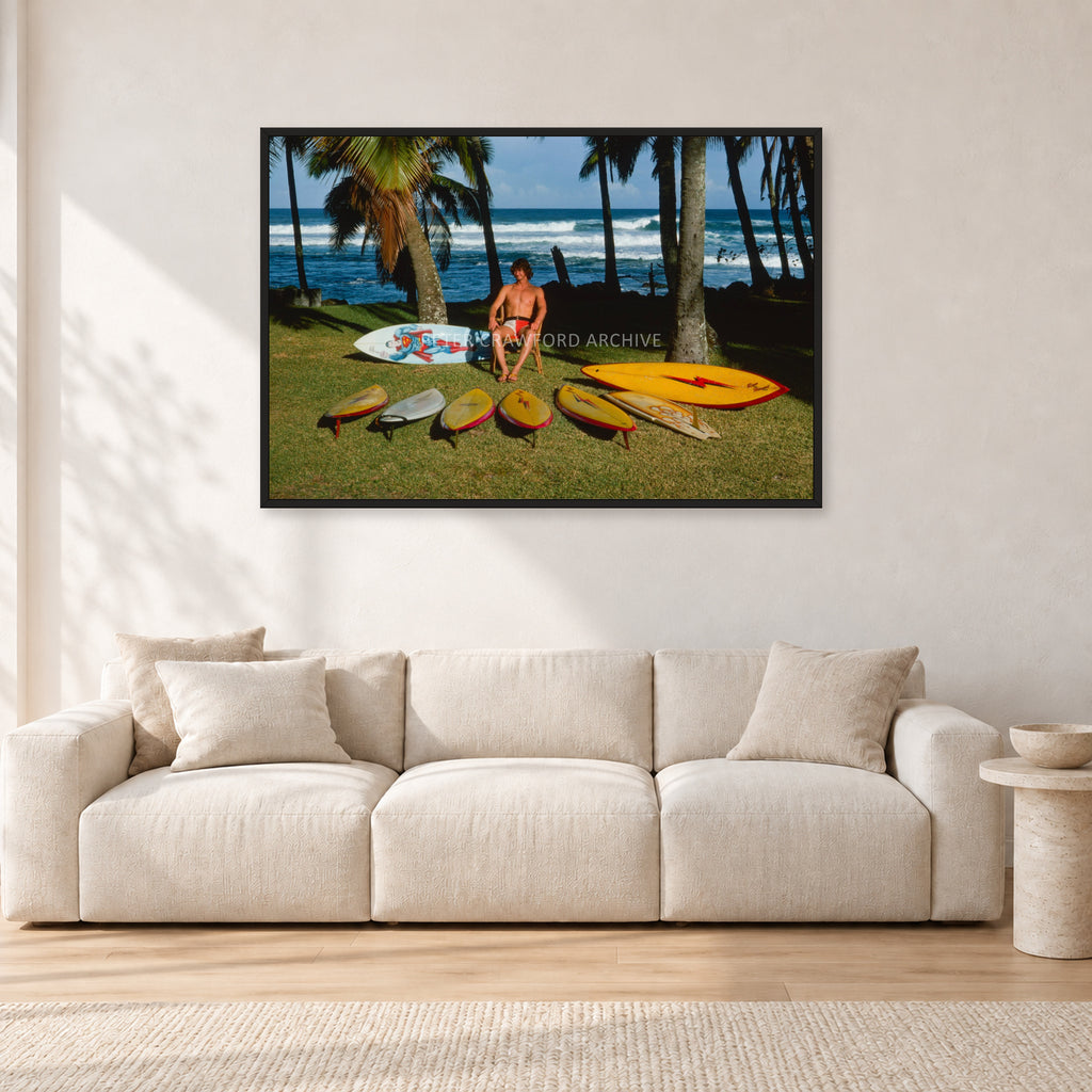 Mark Richards Hawaiian Quiver, North Shore 1976 by Peter Crawford — 120 × 80 cm, black frame, shown in a light minimalist living room.