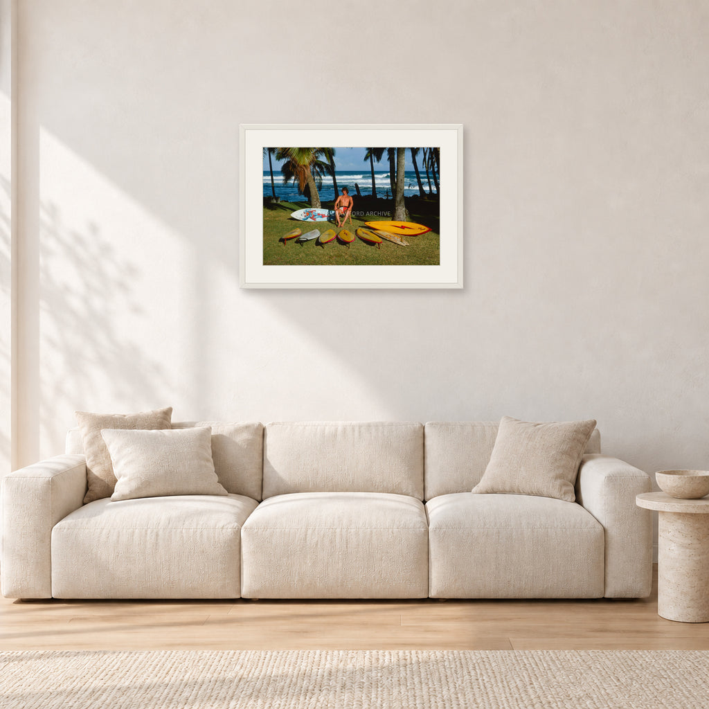 Mark Richards Hawaiian Quiver, North Shore 1976 by Peter Crawford — 60 × 40 cm, white frame with white mat, shown in a light minimalist living room.