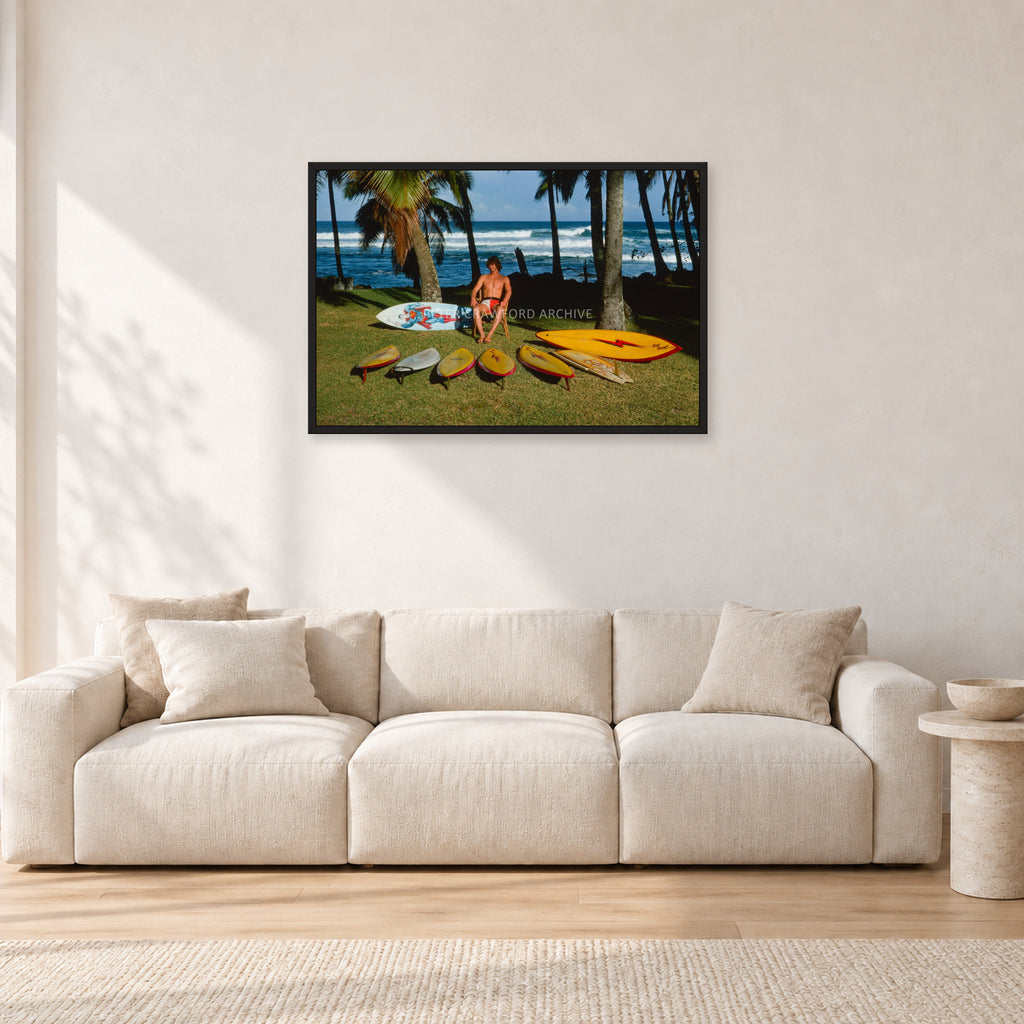 Mark Richards Hawaiian Quiver, North Shore 1976 by Peter Crawford — 90 × 60 cm, black frame, shown in a light minimalist living room.