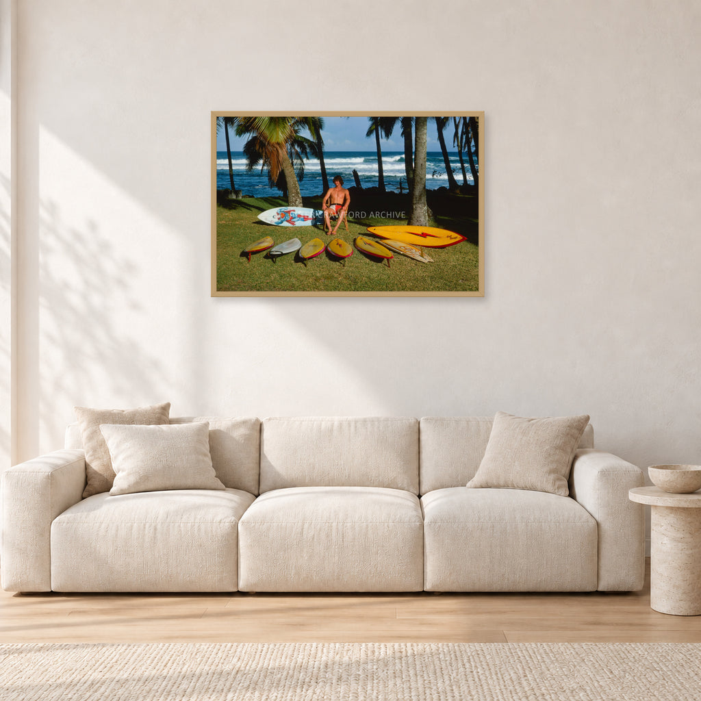 Mark Richards Hawaiian Quiver, North Shore 1976 by Peter Crawford — 90 × 60 cm, hayseed frame, shown in a light minimalist living room.
