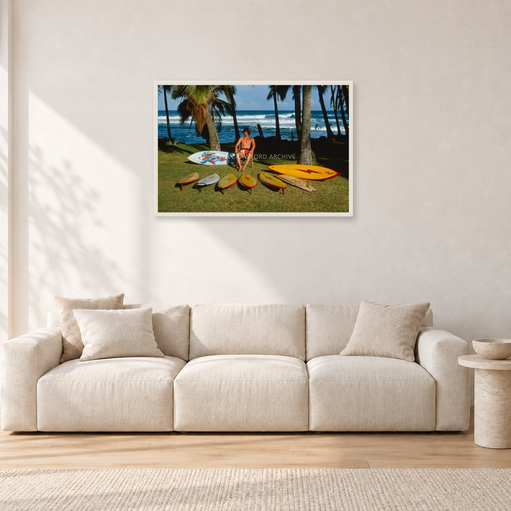 Mark Richards Hawaiian Quiver, North Shore 1976 by Peter Crawford — 90 × 60 cm, white frame, shown in a light minimalist living room.