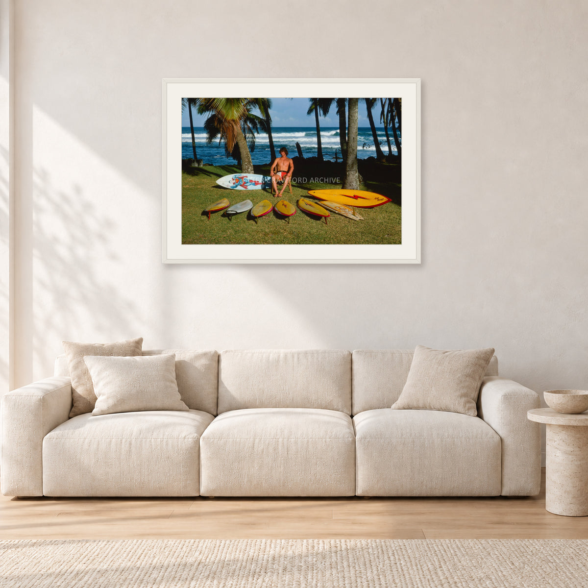 Mark Richards Hawaiian Quiver, North Shore 1976 by Peter Crawford — 90 × 60 cm, white frame with white mat, shown in a light minimalist living room.