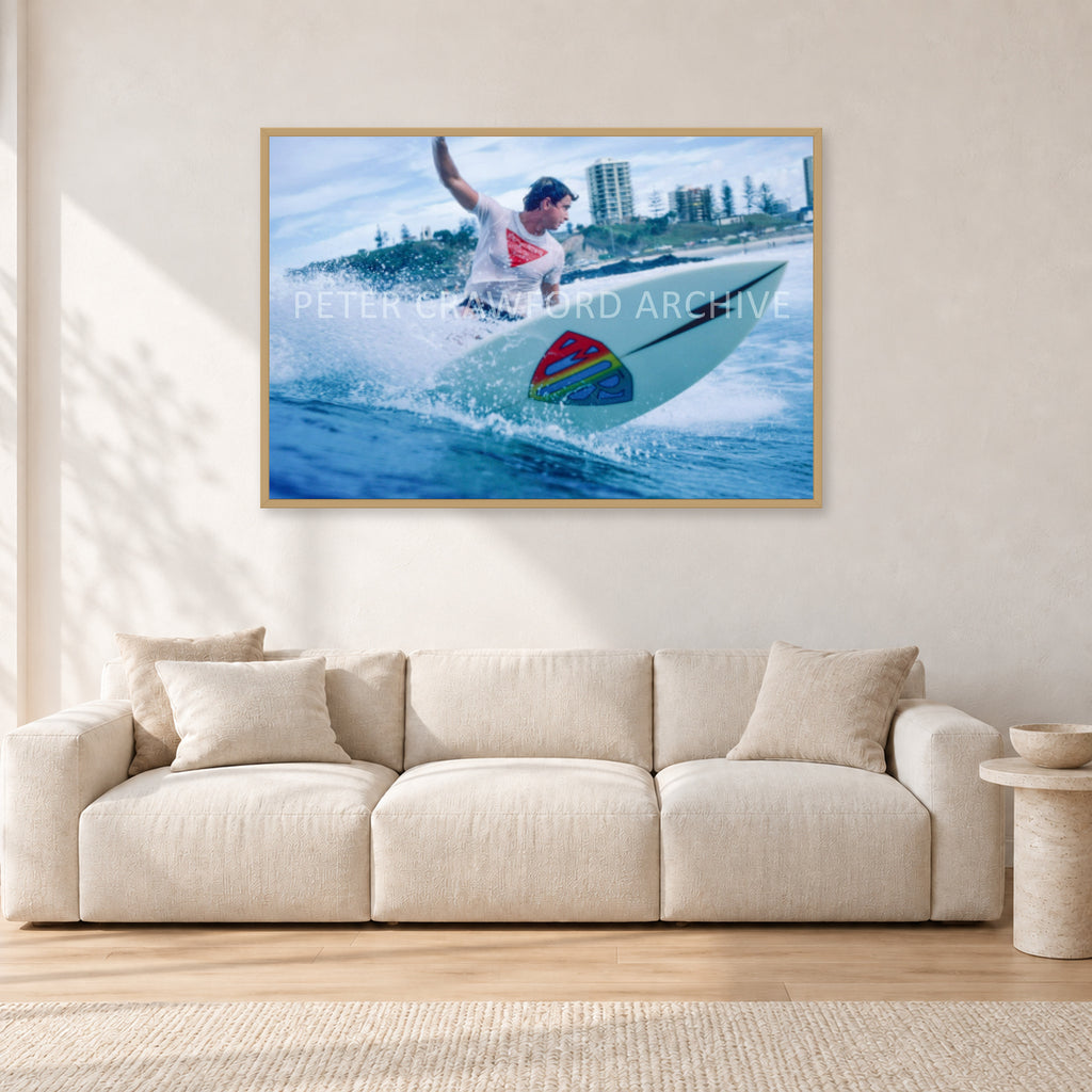 Mark Richards, Snapper Rocks by Peter Crawford — 120 × 80 cm, hayseed frame, shown in a light minimalist living room.