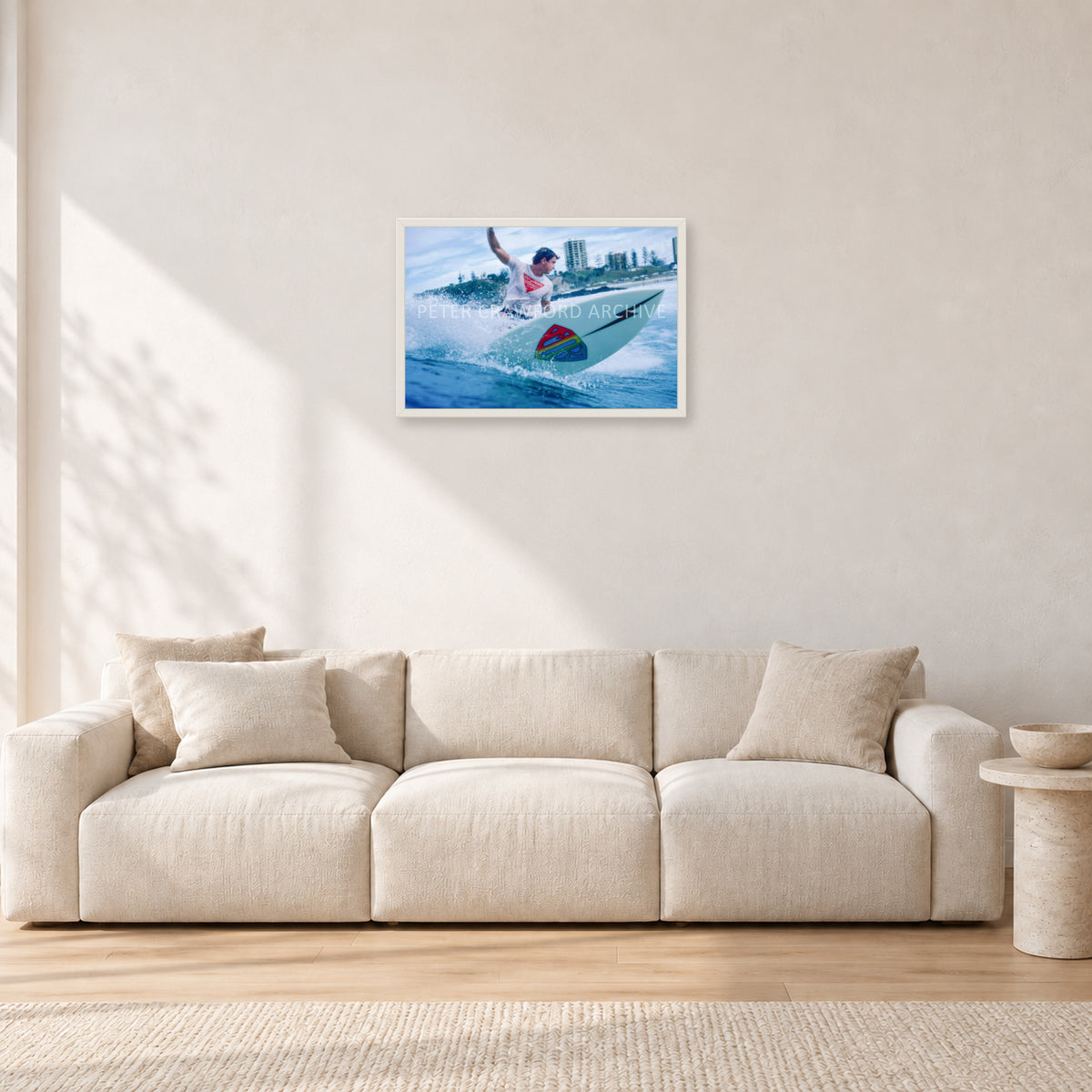 Mark Richards, Snapper Rocks by Peter Crawford — 60 × 40 cm, white frame, shown in a light minimalist living room.