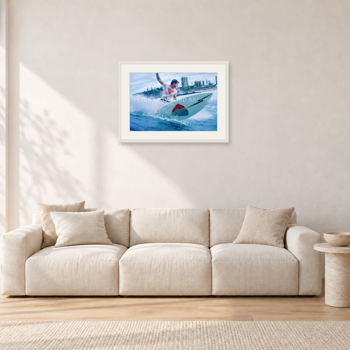 Mark Richards, Snapper Rocks by Peter Crawford — 60 × 40 cm, white frame with white mat, shown in a light minimalist living room.