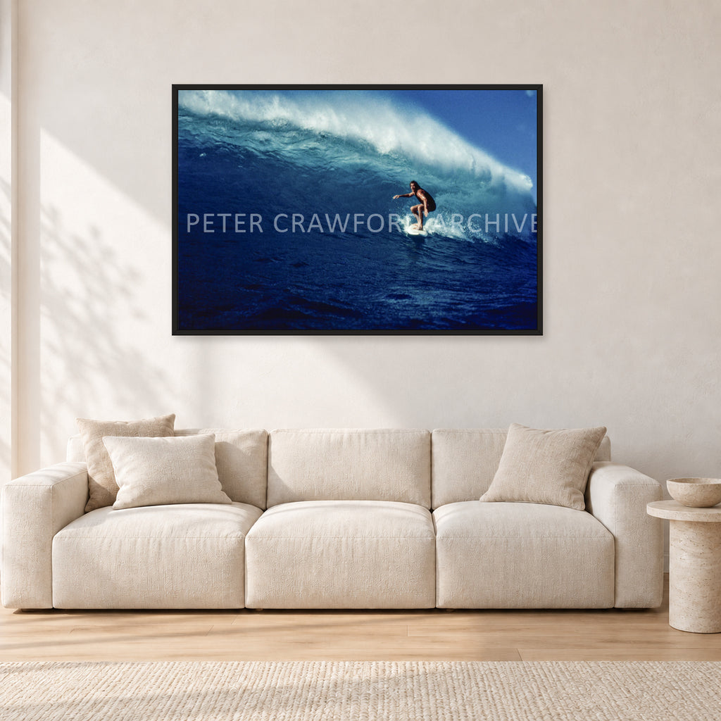 Michael Peterson, Sunset Beach 1975 by Peter Crawford — 120 × 80 cm, black frame, shown in a light minimalist living room.