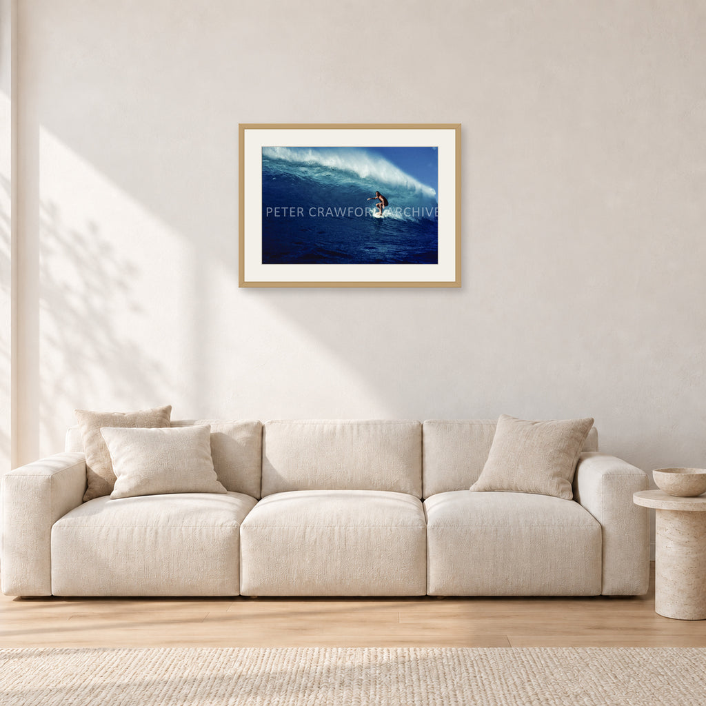 Michael Peterson, Sunset Beach 1975 by Peter Crawford — 60 × 40 cm, hayseed frame with white mat, shown in a light minimalist living room.