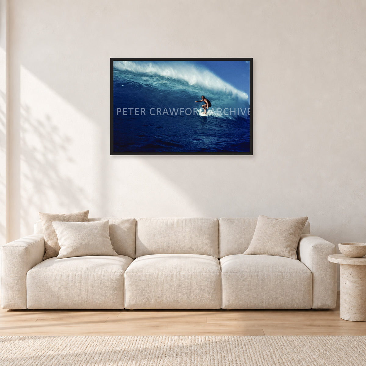Michael Peterson, Sunset Beach 1975 by Peter Crawford — 90 × 60 cm, black frame, shown in a light minimalist living room.