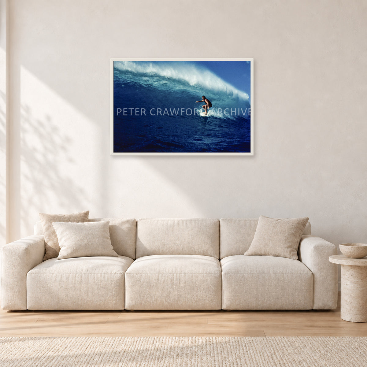 Michael Peterson, Sunset Beach 1975 by Peter Crawford — 90 × 60 cm, white frame, shown in a light minimalist living room.