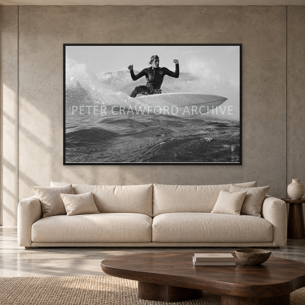 MP Cutback by Peter Crawford — 152 × 102 cm, black full frame, shown to scale in a contemporary concrete-wall living room.