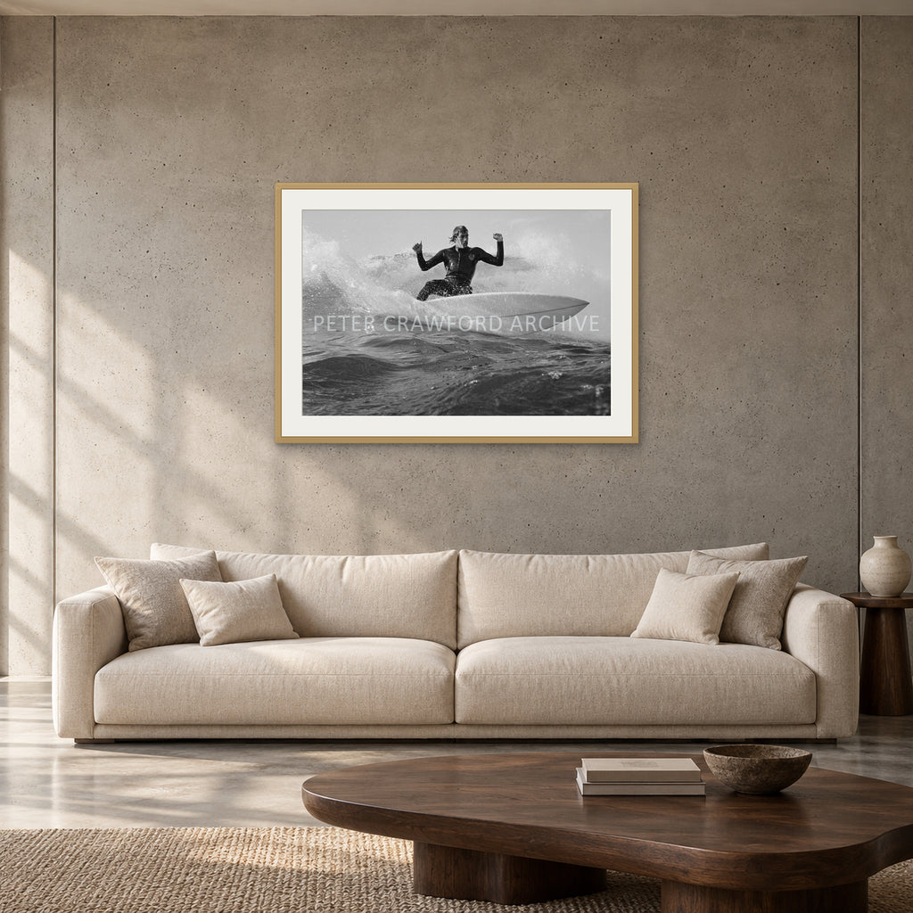 MP Cutback by Peter Crawford — 90 × 60 cm, hayseed frame with mat, shown to scale in a contemporary concrete-wall living room.