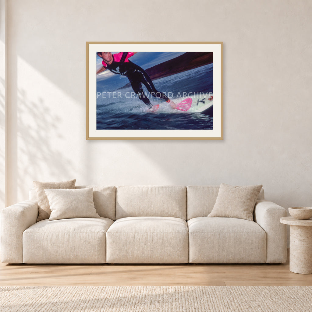 MR Bells 83 by Peter Crawford — 90 × 60 cm, hayseed frame with white mat, shown in a light minimalist living room.