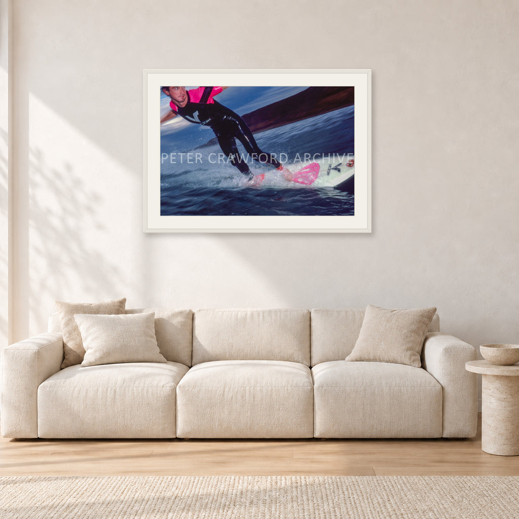 MR Bells 83 by Peter Crawford — 90 × 60 cm, white frame with white mat, shown in a light minimalist living room.