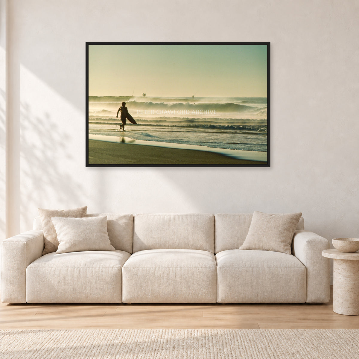Narrabeen Surfer Fish, Dawn 1991 by Peter Crawford — 120 × 80 cm, black frame, shown in a light minimalist living room.