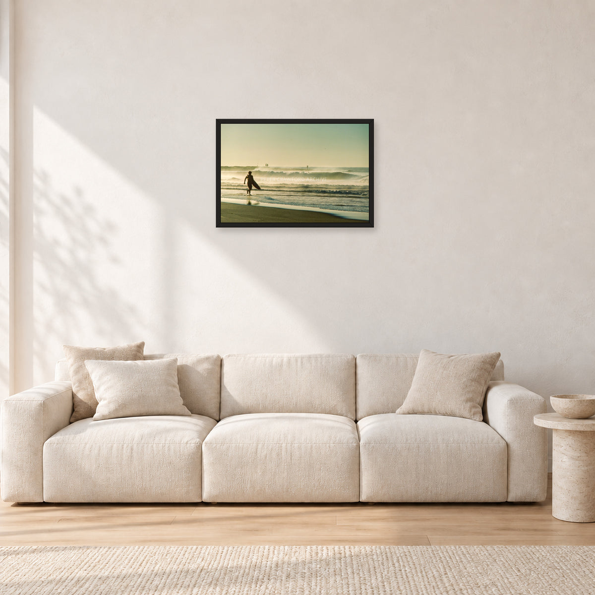 Narrabeen Surfer Fish, Dawn 1991 by Peter Crawford — 60 × 40 cm, black frame, shown in a light minimalist living room.