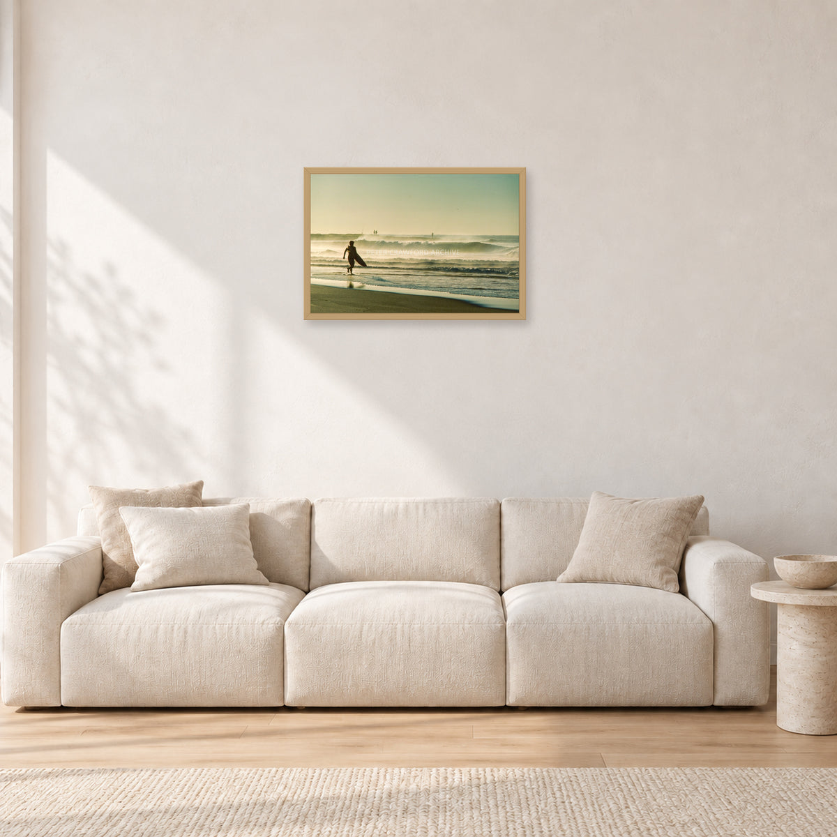 Narrabeen Surfer Fish, Dawn 1991 by Peter Crawford — 60 × 40 cm, hayseed frame, shown in a light minimalist living room.