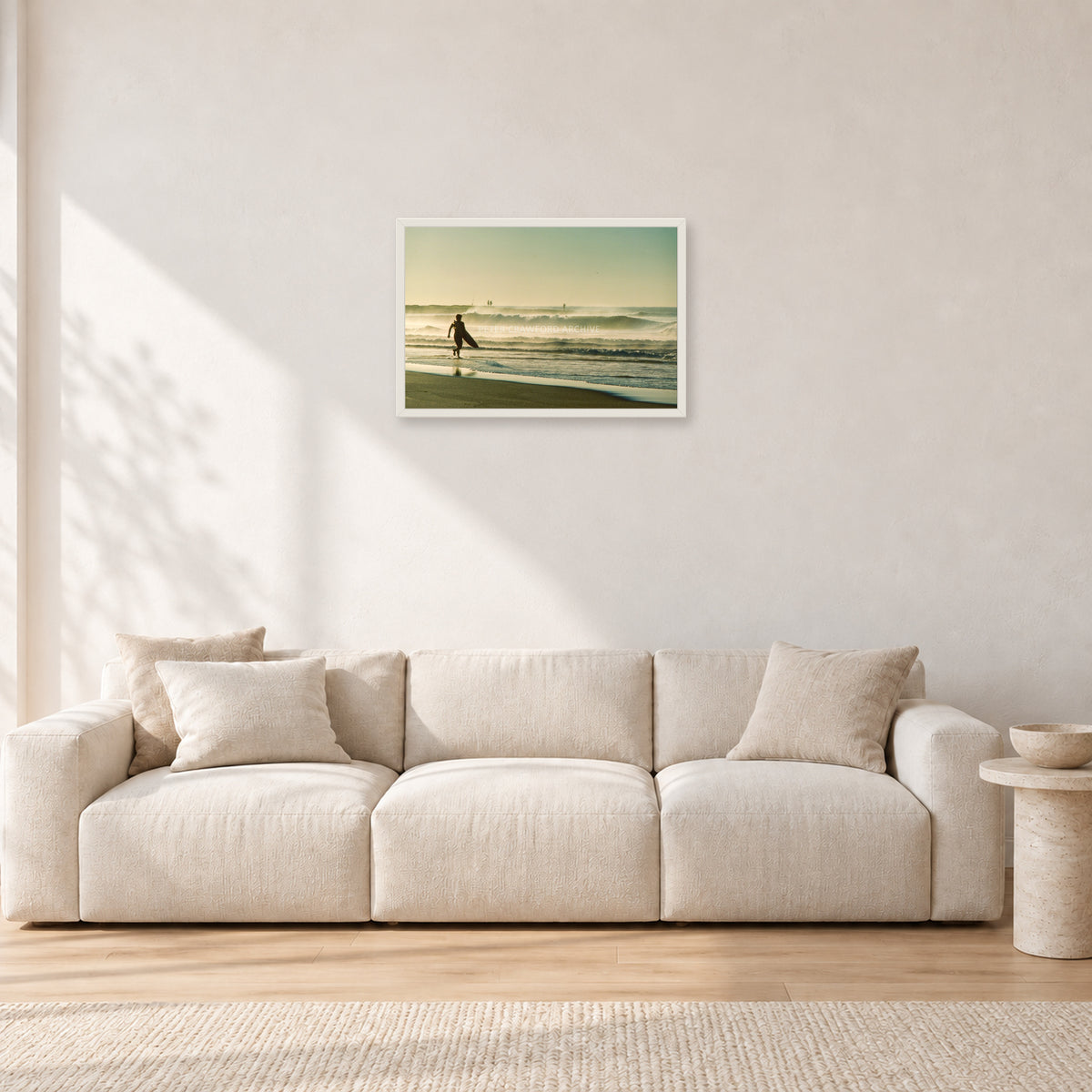 Narrabeen Surfer Fish, Dawn 1991 by Peter Crawford — 60 × 40 cm, white frame, shown in a light minimalist living room.