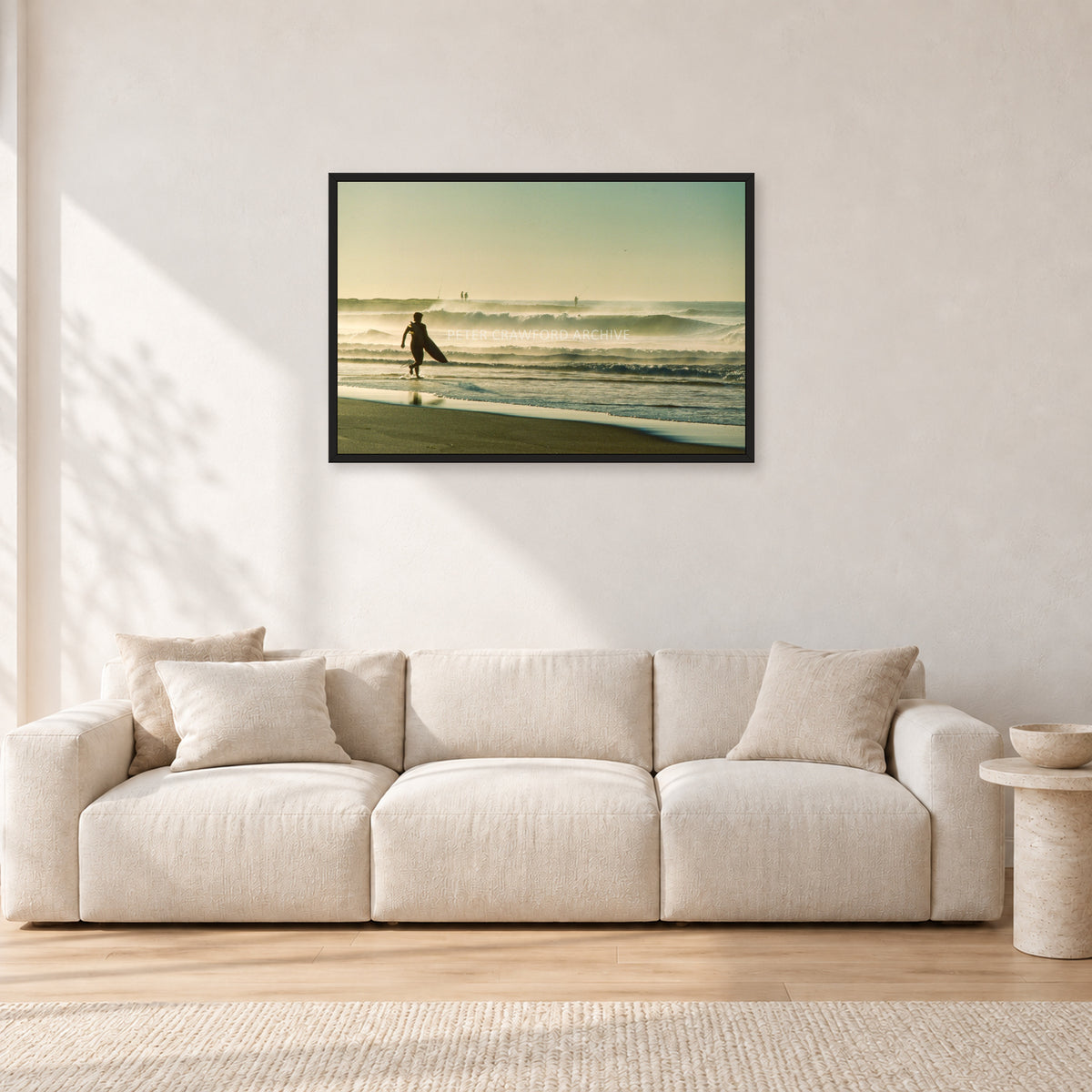 Narrabeen Surfer Fish, Dawn 1991 by Peter Crawford — 90 × 60 cm, black frame, shown in a light minimalist living room.