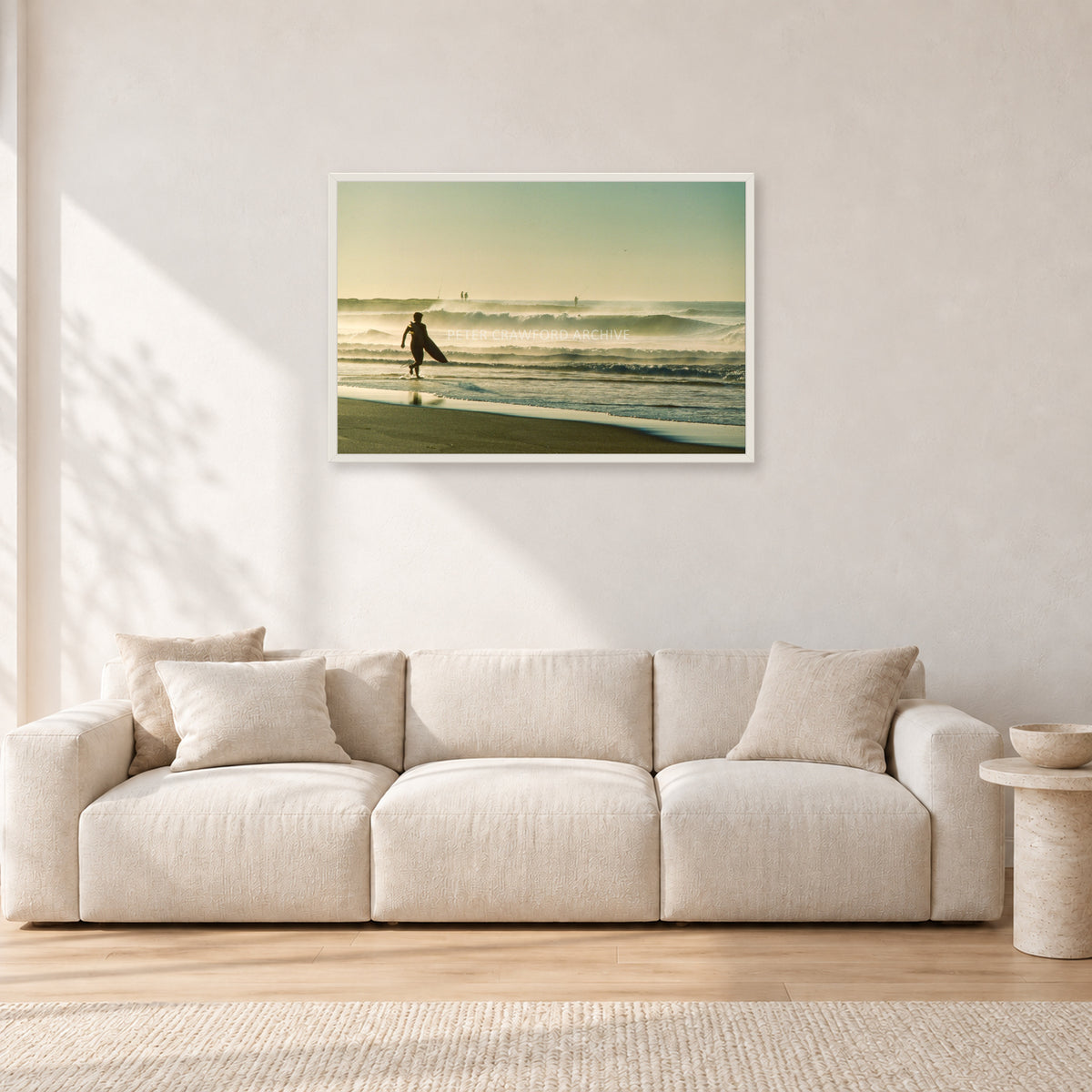 Narrabeen Surfer Fish, Dawn 1991 by Peter Crawford — 90 × 60 cm, white frame, shown in a light minimalist living room.