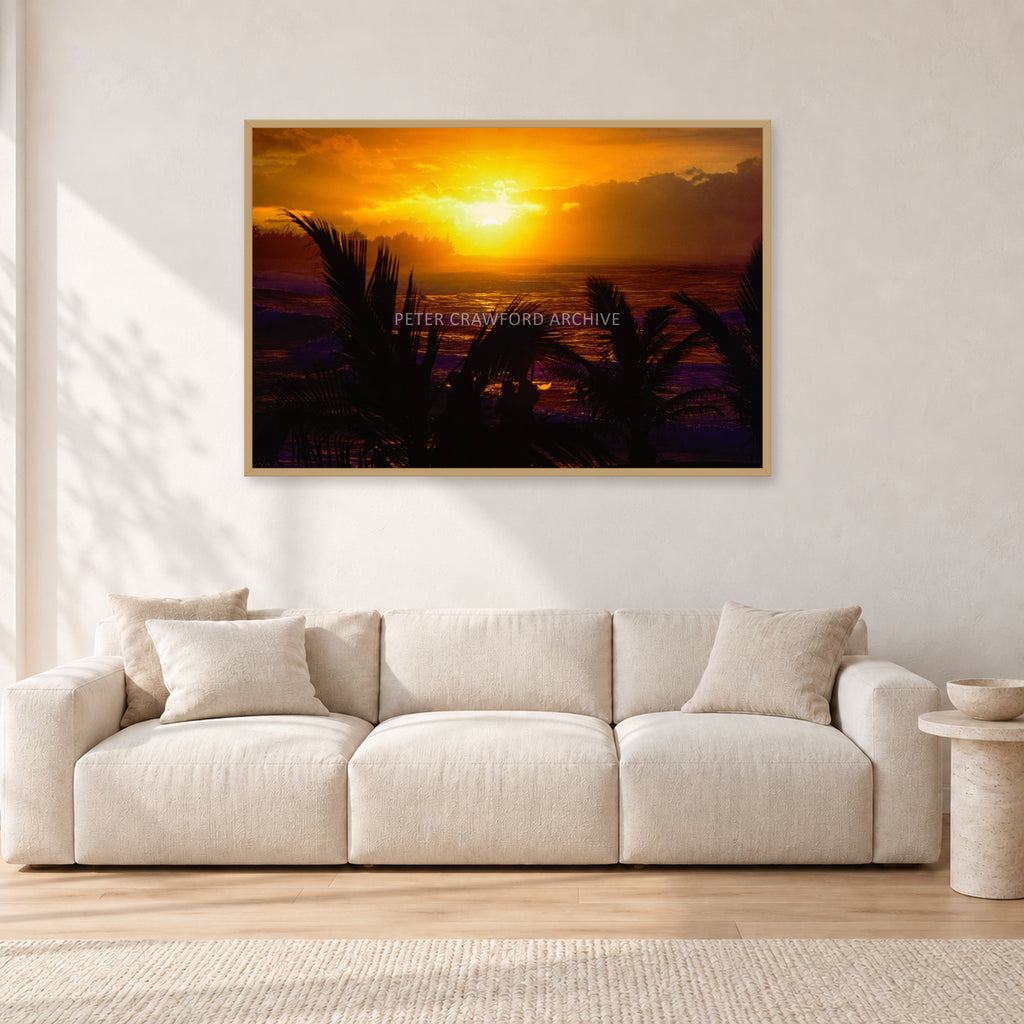 North Shore Sunset by Peter Crawford — 120 × 80 cm, hayseed frame, shown in a light minimalist living room.