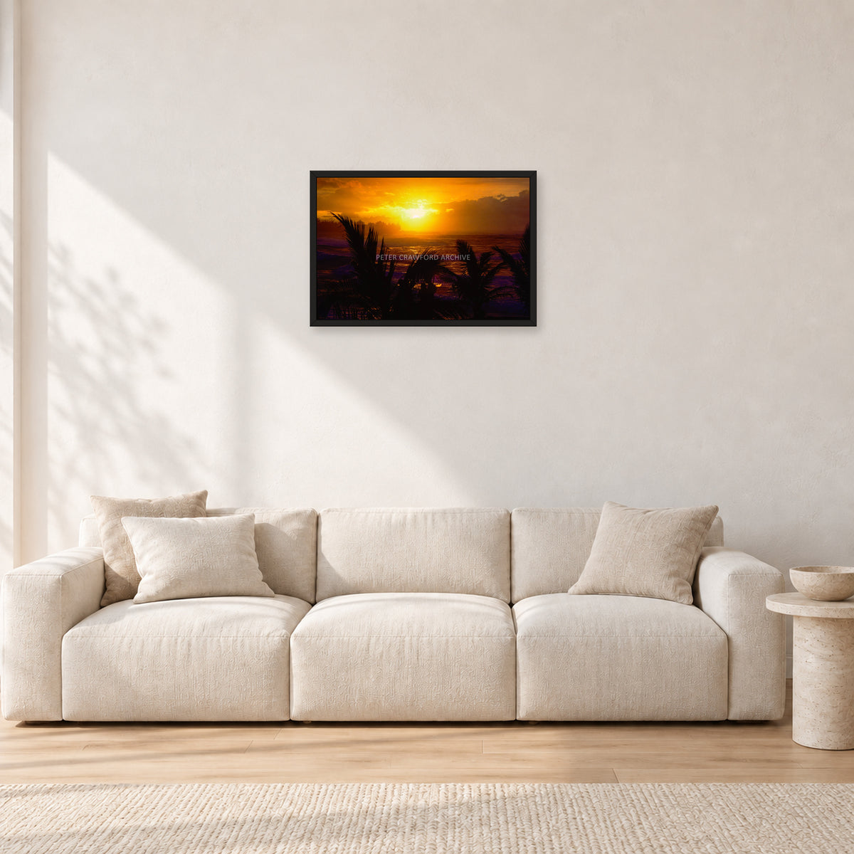 North Shore Sunset by Peter Crawford — 60 × 40 cm, black frame, shown in a light minimalist living room.