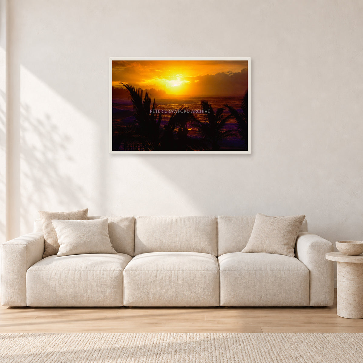 North Shore Sunset by Peter Crawford — 90 × 60 cm, white frame, shown in a light minimalist living room.