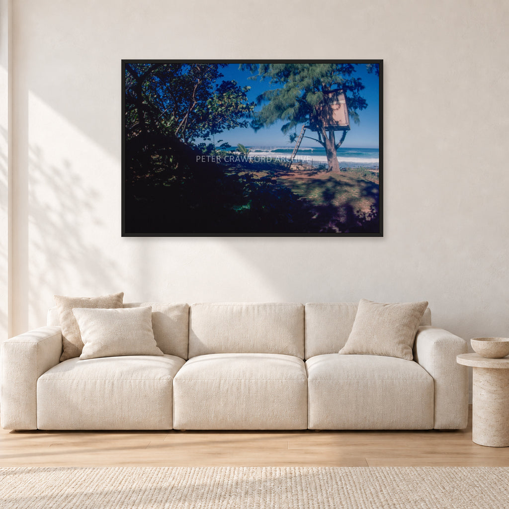 North Shore Tree House, 1978 by Peter Crawford — 120 × 80 cm, black frame, shown in a light minimalist living room.