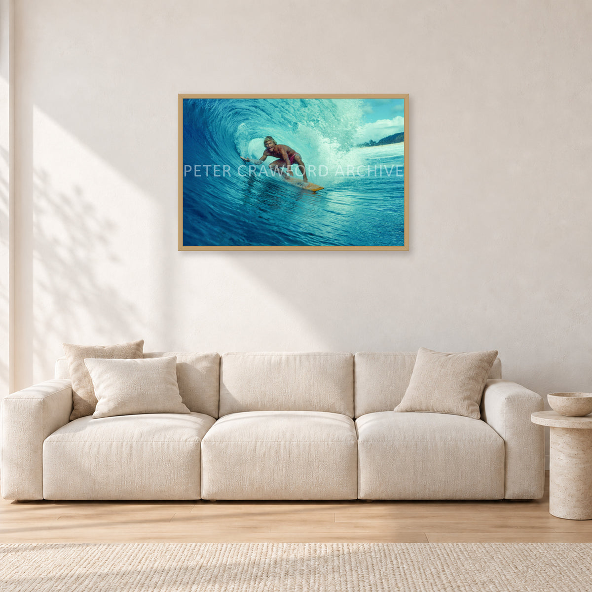 North Shore Tube Ride, Hawaii 1970s by Peter Crawford — 90 × 60 cm, hayseed frame, shown in a light minimalist living room.