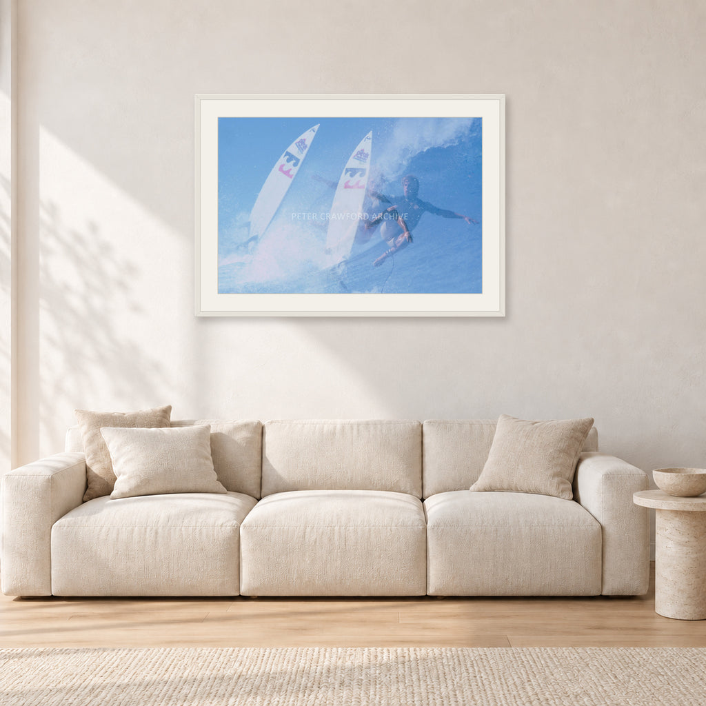 Occy Double Exposure, 1984 by Peter Crawford — 90 × 60 cm, white frame with white mat, shown in a light minimalist living room.