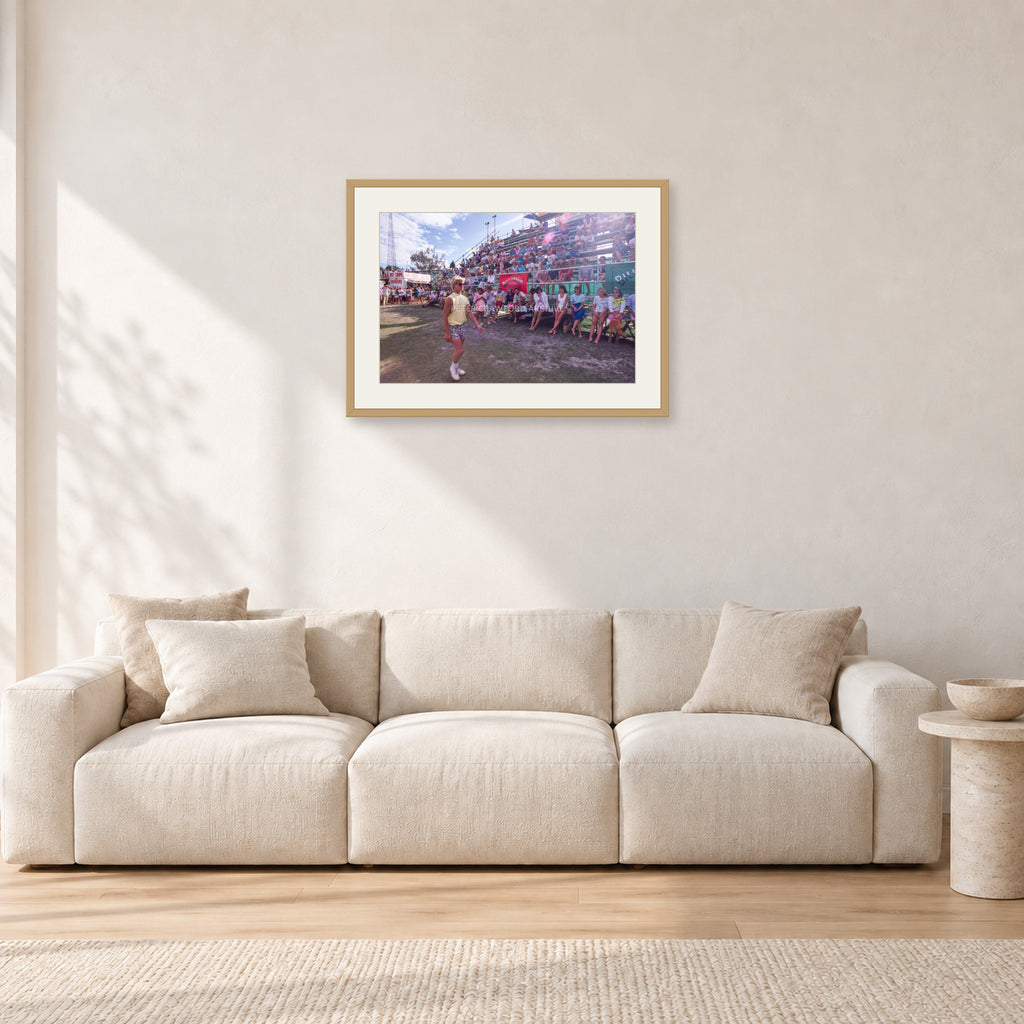 Occy, Duranbah by Peter Crawford — 60 × 40 cm, hayseed frame with white mat, shown in a light minimalist living room.