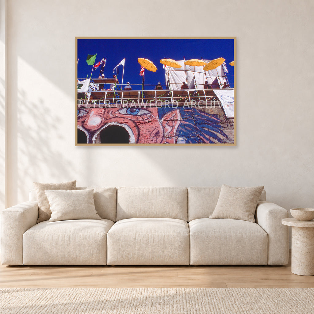 OP Bondi 87 OnTheNose by Peter Crawford — 120 × 80 cm, hayseed frame, shown in a light minimalist living room.