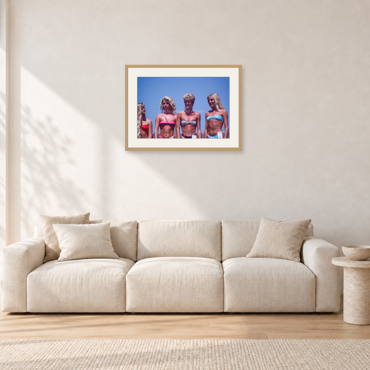 OP Pro Pageant, 1985 by Peter Crawford — 60 × 40 cm, hayseed frame with white mat, shown in a light minimalist living room.