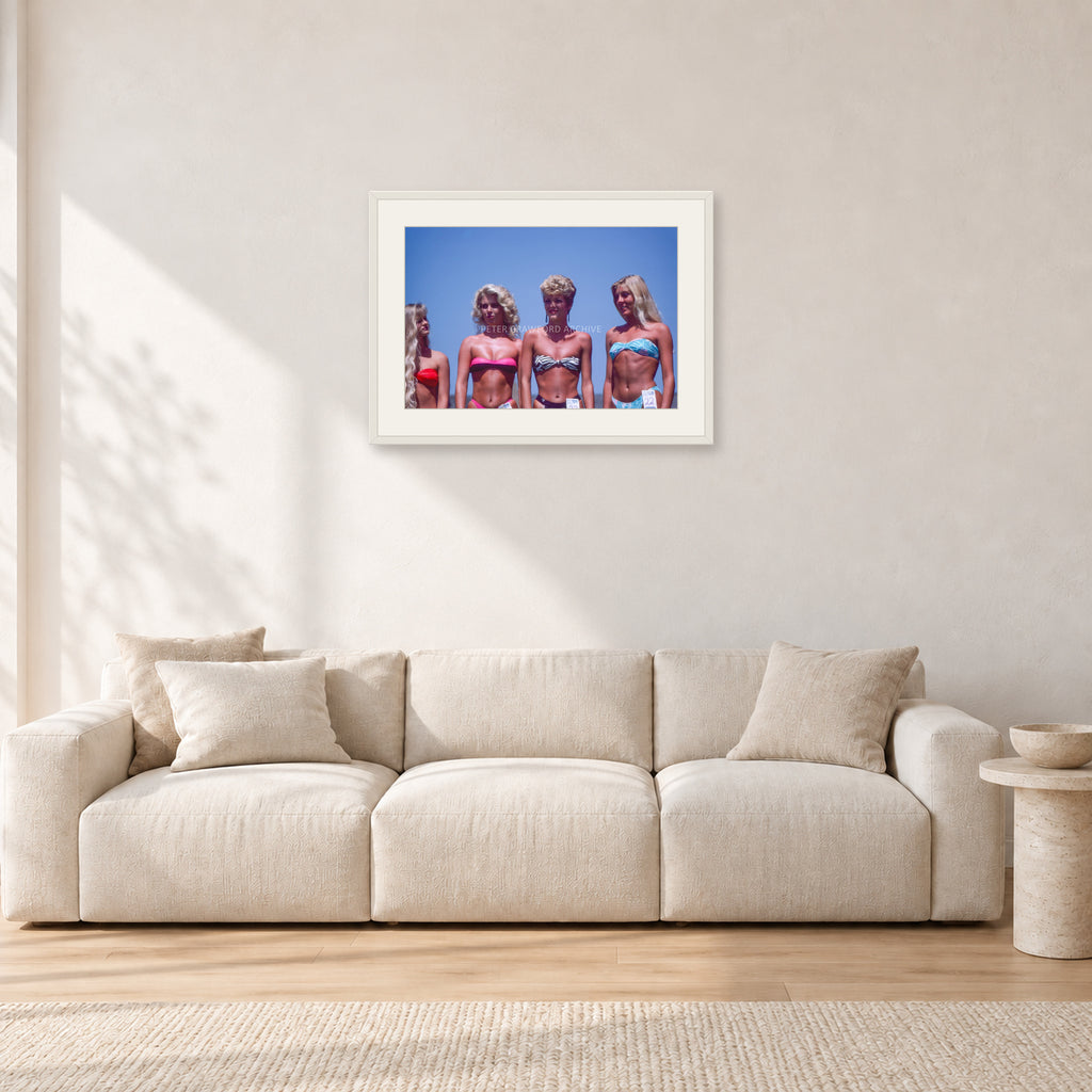 OP Pro Pageant, 1985 by Peter Crawford — 60 × 40 cm, white frame with white mat, shown in a light minimalist living room.