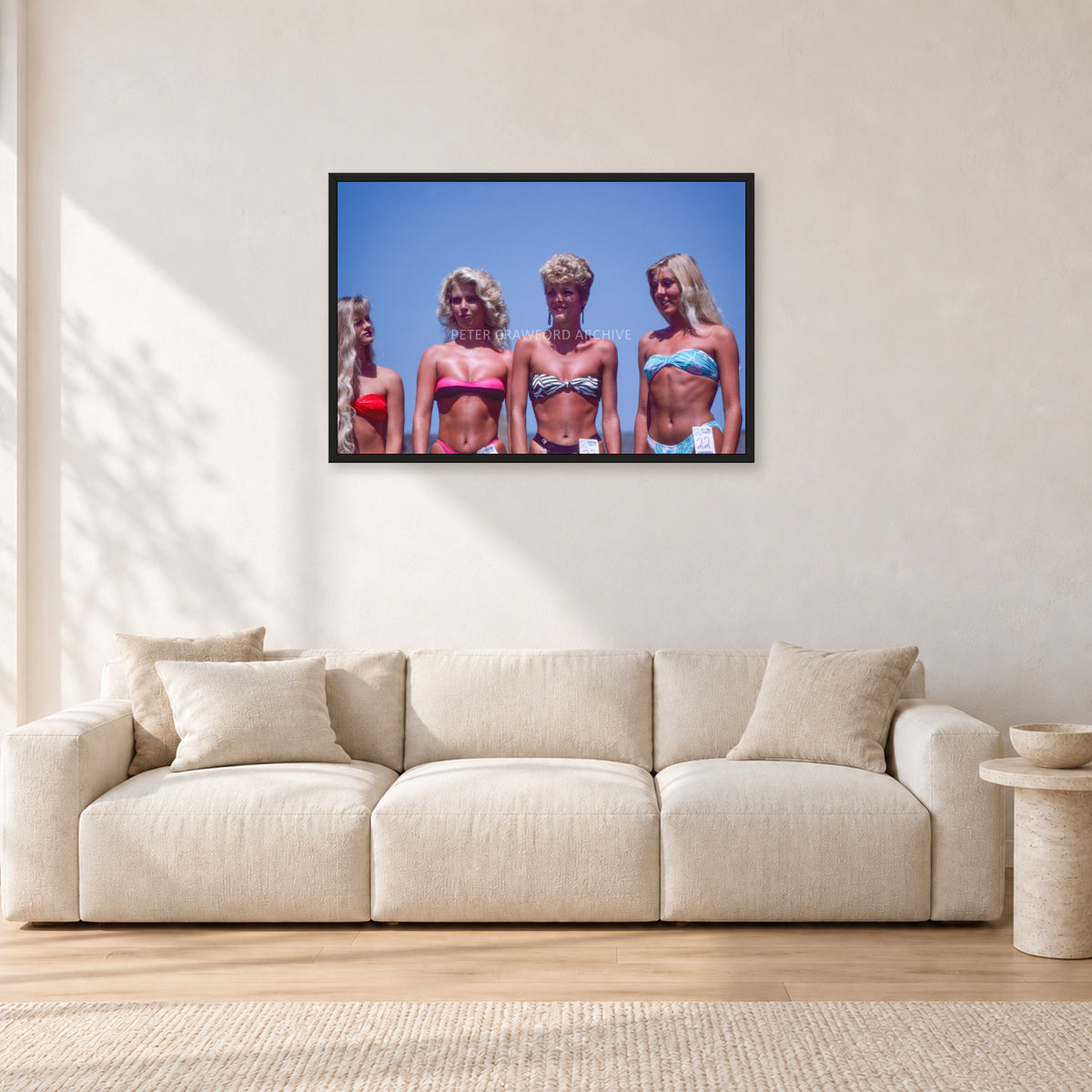 OP Pro Pageant, 1985 by Peter Crawford — 90 × 60 cm, black frame, shown in a light minimalist living room.