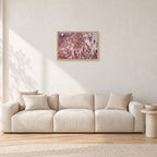 Op Pro Crowd 85 by Peter Crawford — 60 × 40 cm, hayseed frame, shown in a light minimalist living room.