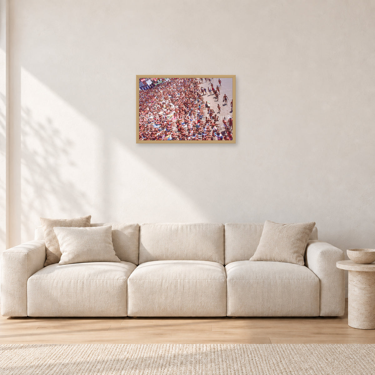 Op Pro Crowd 85 by Peter Crawford — 60 × 40 cm, hayseed frame, shown in a light minimalist living room.