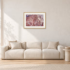 Op Pro Crowd 85 by Peter Crawford — 60 × 40 cm, hayseed frame with white mat, shown in a light minimalist living room.