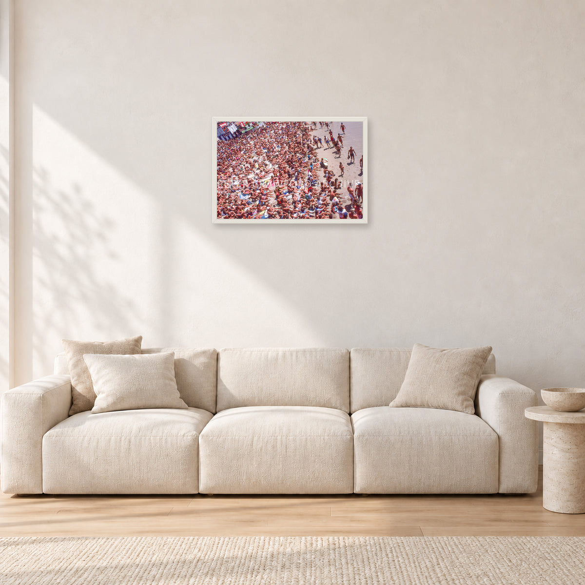 Op Pro Crowd 85 by Peter Crawford — 60 × 40 cm, white frame, shown in a light minimalist living room.