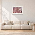 Op Pro Crowd 85 by Peter Crawford — 60 × 40 cm, white frame with white mat, shown in a light minimalist living room.