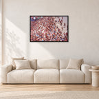 Op Pro Crowd 85 by Peter Crawford — 90 × 60 cm, black frame, shown in a light minimalist living room.