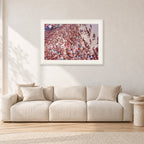 Op Pro Crowd 85 by Peter Crawford — 90 × 60 cm, white frame with white mat, shown in a light minimalist living room.