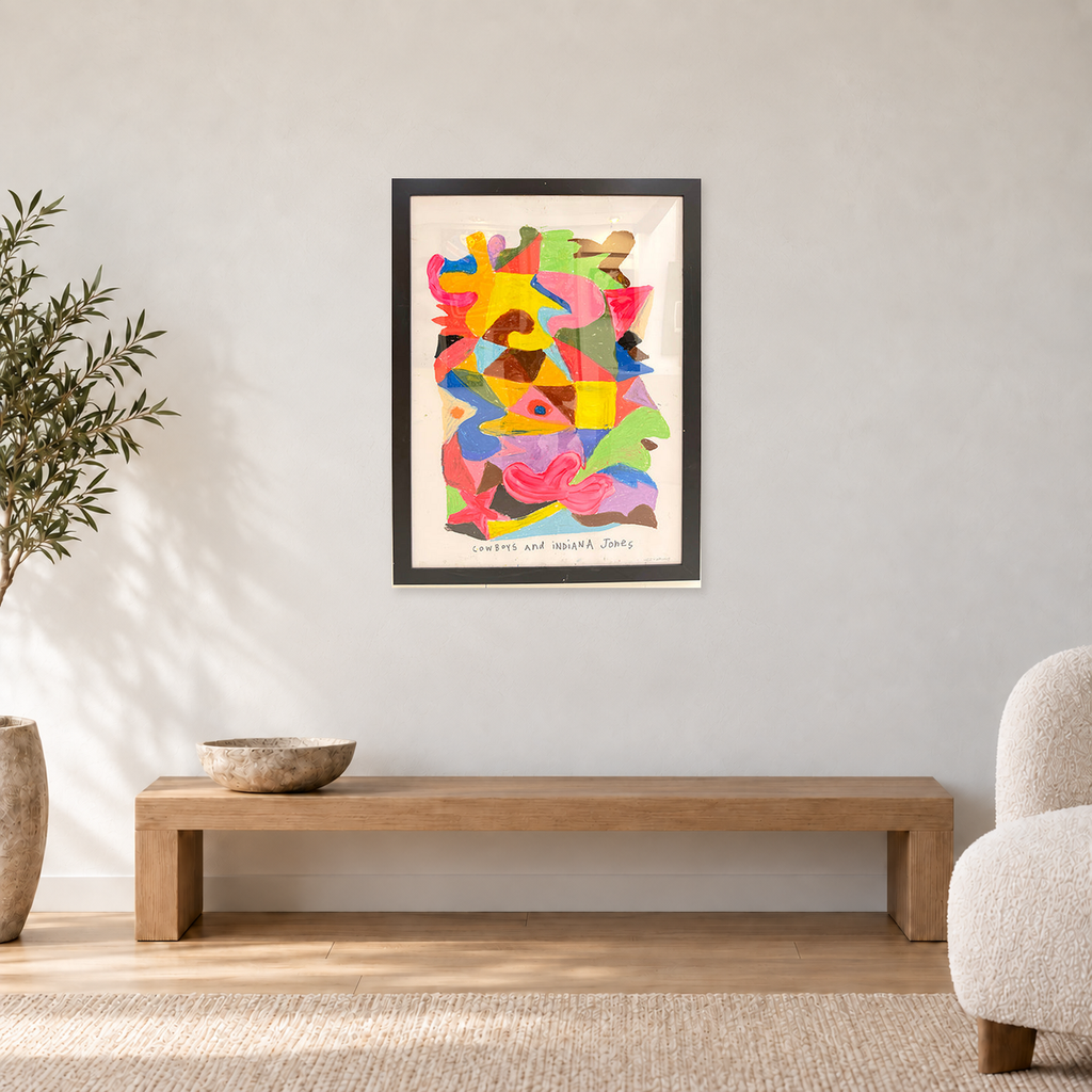 Ozzie Wright - COWBOYS AND INDIANA JONES, displayed at 68 × 90 cm including frame above an oak bench in a neutral room