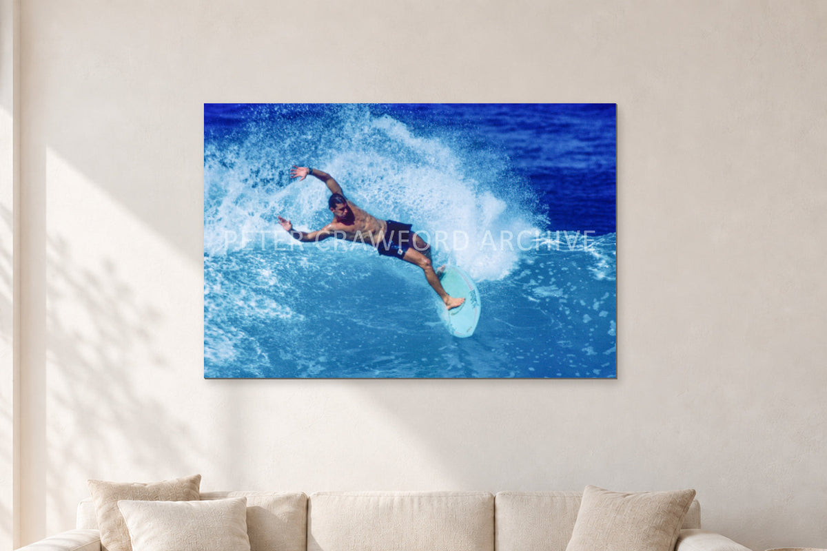 Paul Burnett, Hawaii 1989 by Peter Crawford — 120 × 80 cm, aluminium-mounted resin print, shown in a light minimalist living room.