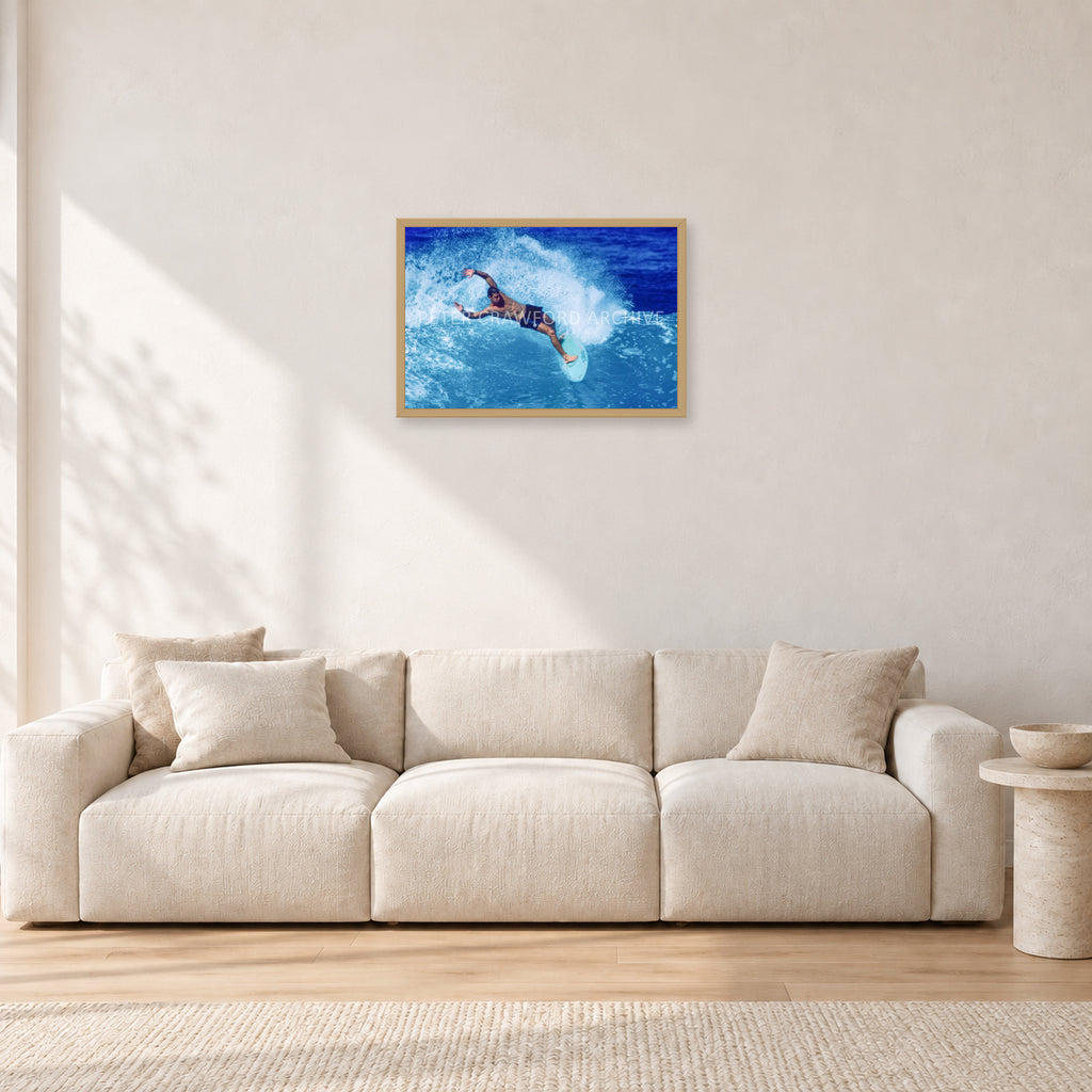 Paul Burnett, Hawaii 1989 by Peter Crawford — 60 × 40 cm, hayseed frame, shown in a light minimalist living room.