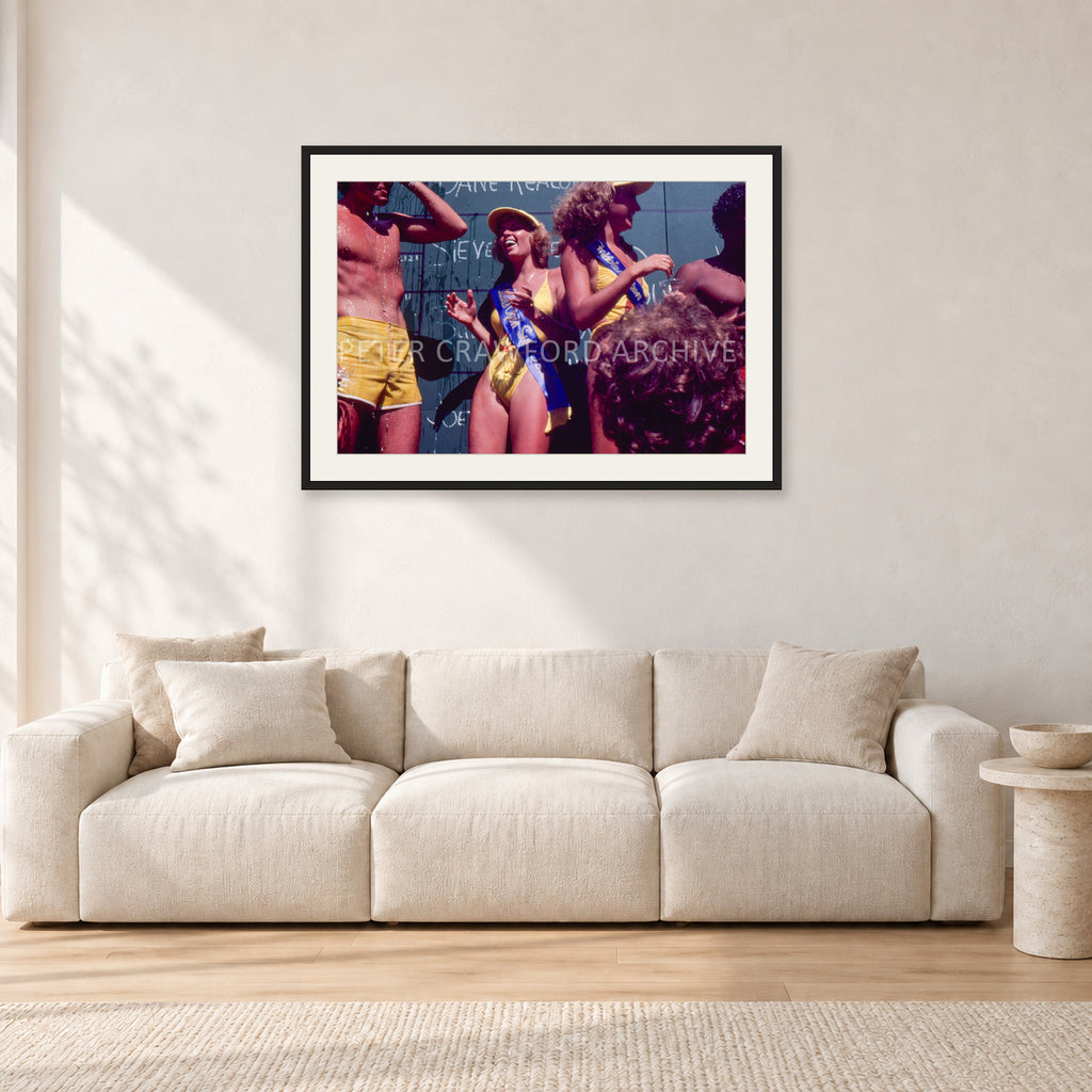 Peter Harris Champ ShowerStubbies 80 by Peter Crawford — 90 × 60 cm, black frame with white mat, shown in a light minimalist living room.